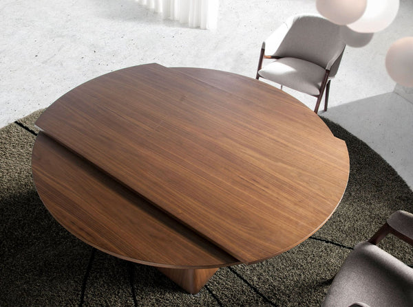 Round extendable walnut dining table