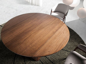Round extendable walnut dining table
