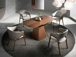 Round extendable walnut dining table