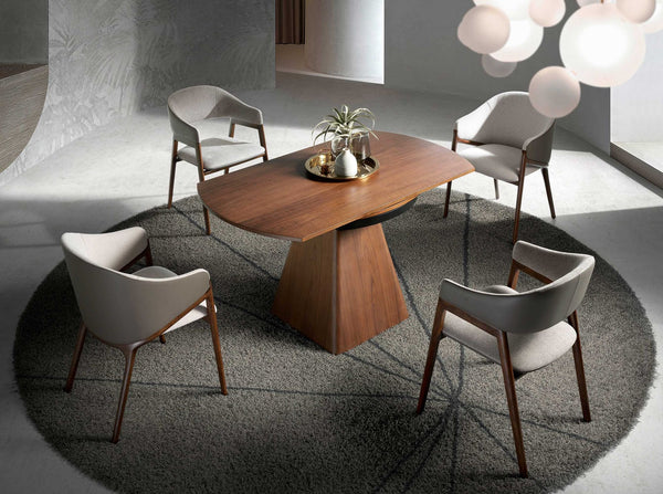 Round extendable walnut dining table