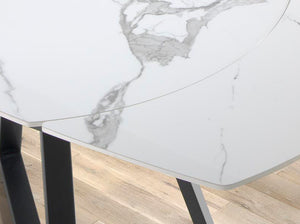 Extendable oval barrel dining table in porcelain marble and black steel