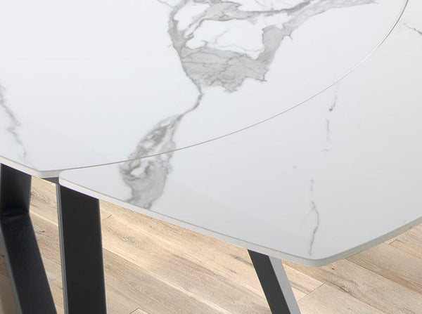 Extendable oval barrel dining table in porcelain marble and black steel