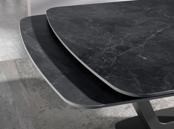 Extendable oval barrel dining table in porcelain marble and black steel
