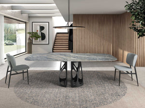 Oval barrel dining table in porcelain marble and black steel