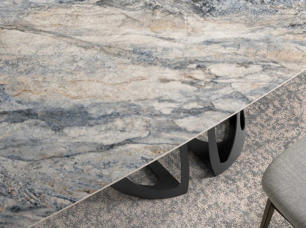Oval barrel dining table in porcelain marble and black steel