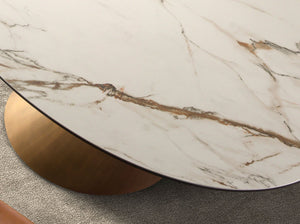 Extendable oval dining table with porcelain marble and bronzed steel barrel