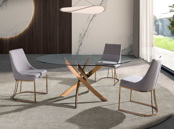 Round dining table in tempered glass and pink steel