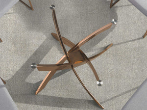 Round dining table in tempered glass and pink steel