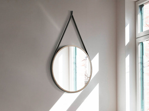 Round walnut wall mirror