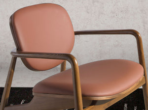 Brown and walnut eco-leather armchair