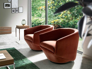 Swivel armchair in peach velvet