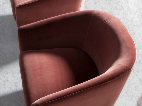 Swivel armchair in peach velvet