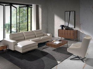 Swivel armchair in taupe gray leather