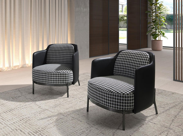 Armchair in black and white fabric and black synthetic leather