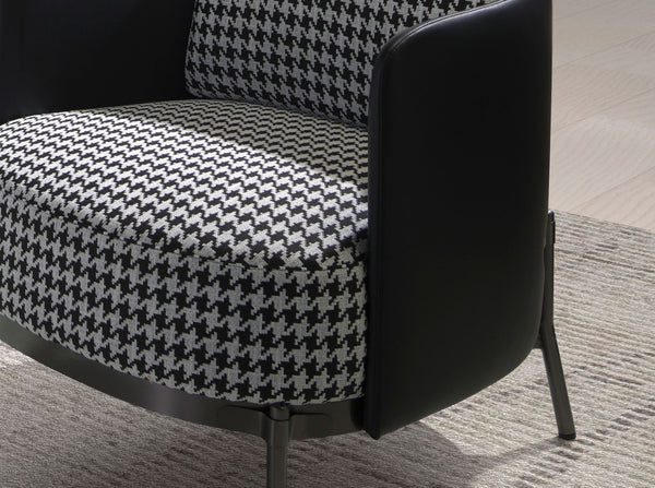Armchair in black and white fabric and black synthetic leather