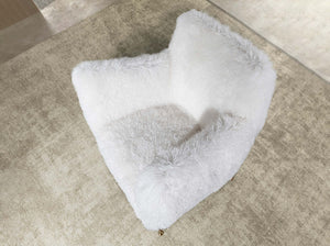 White armchair in long pile fabric