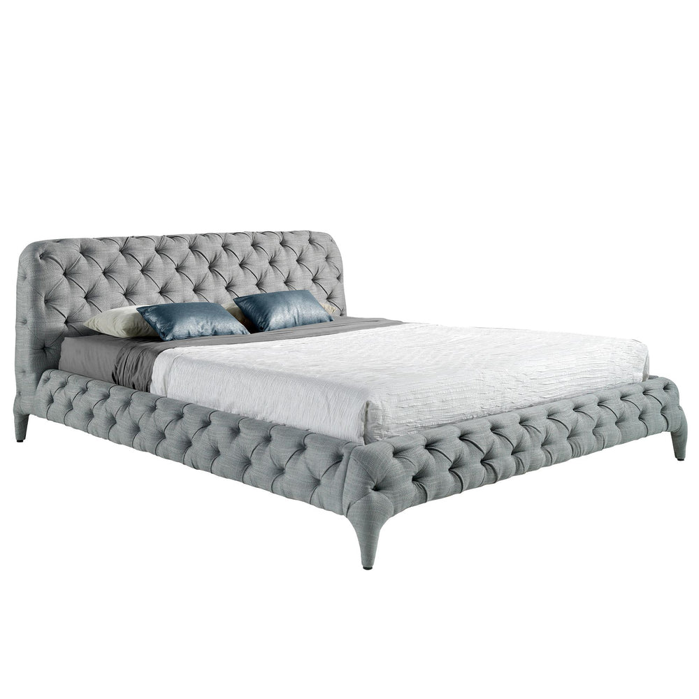 Bed upholstered in gray fabric