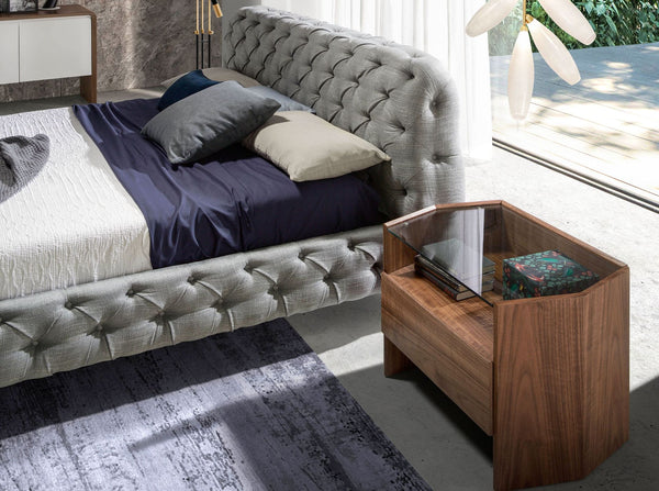 Bed upholstered in gray fabric
