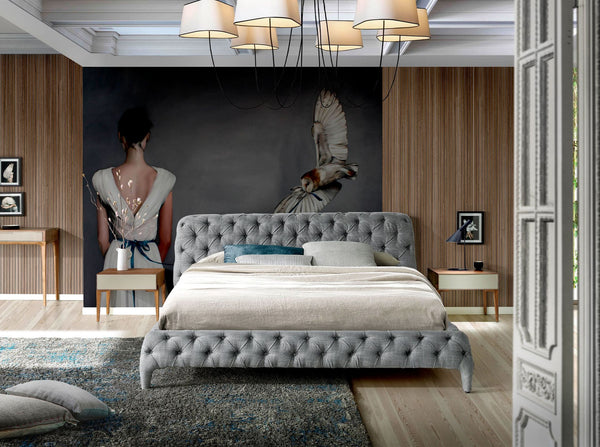 Bed upholstered in gray fabric
