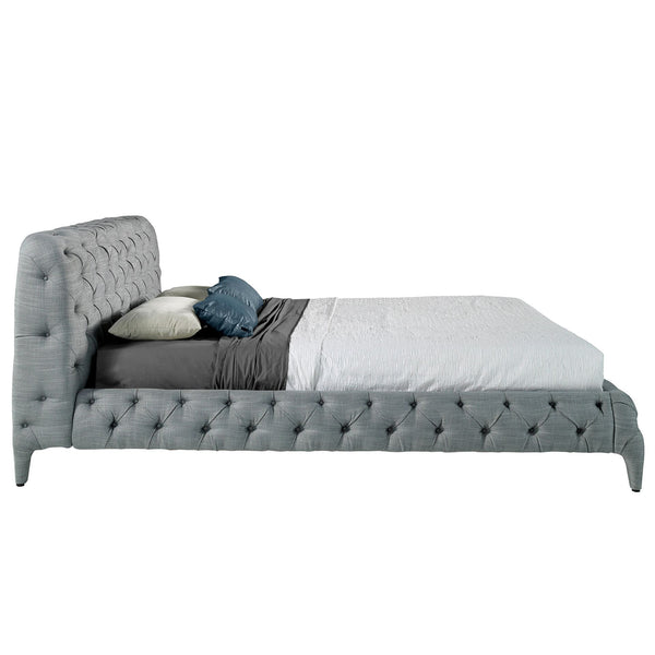 Bed upholstered in gray fabric