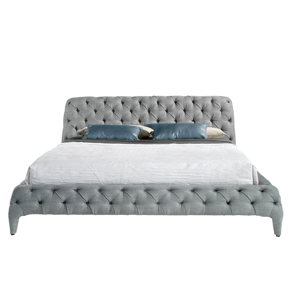 Bed upholstered in gray fabric