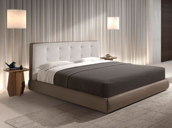 Bed upholstered in brown fabric and brown synthetic leather