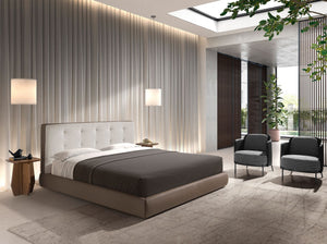Bed upholstered in brown fabric and brown synthetic leather