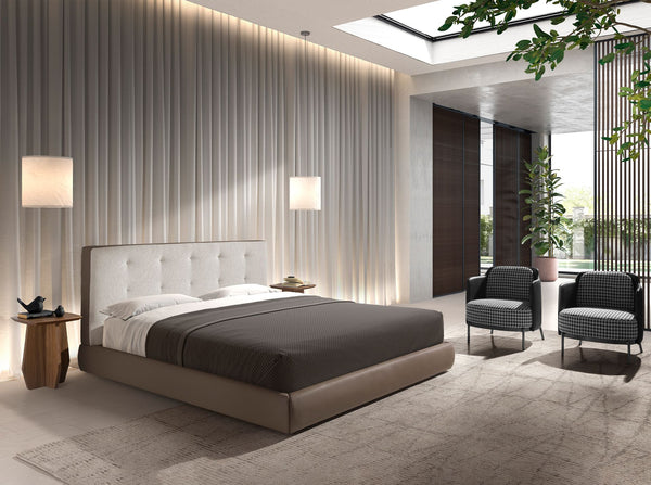 Bed upholstered in brown fabric and brown synthetic leather