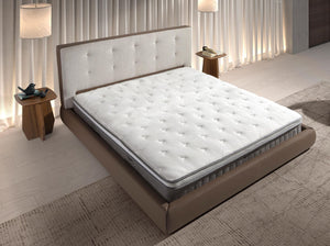 Bed upholstered in brown fabric and brown synthetic leather