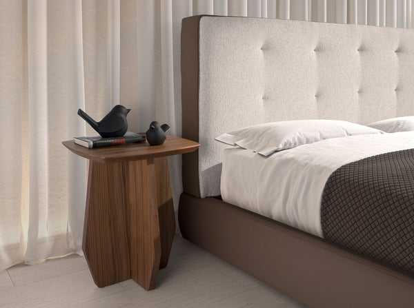 Bed upholstered in brown fabric and brown synthetic leather