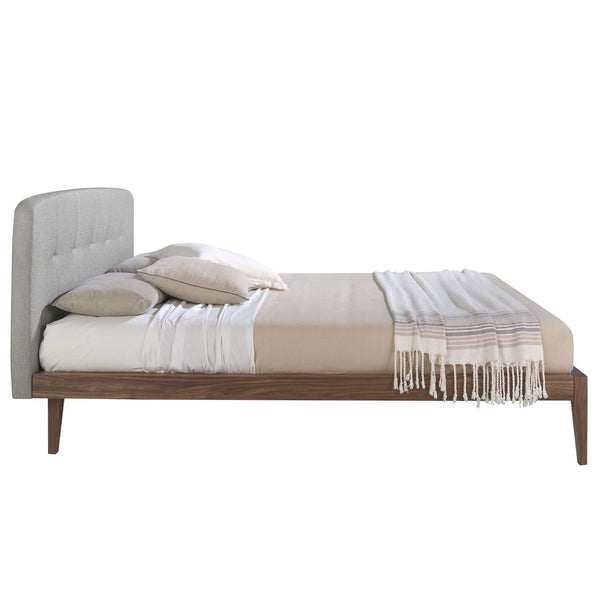 Tufted bed in gray fabric