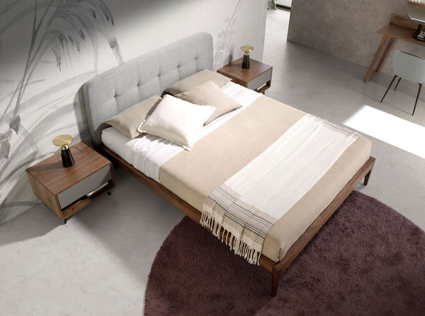 Tufted bed in gray fabric