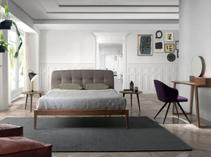 Tufted bed in gray fabric