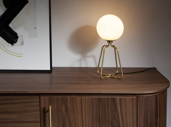 Table lamp in gold steel and white glass
